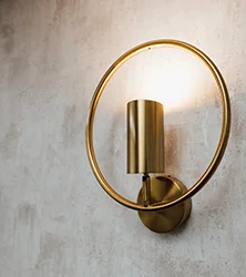 Close up of a gold featured wall light.
